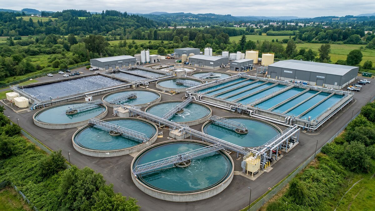 Municipal water treatment plant with circular clarifiers and filtration basins